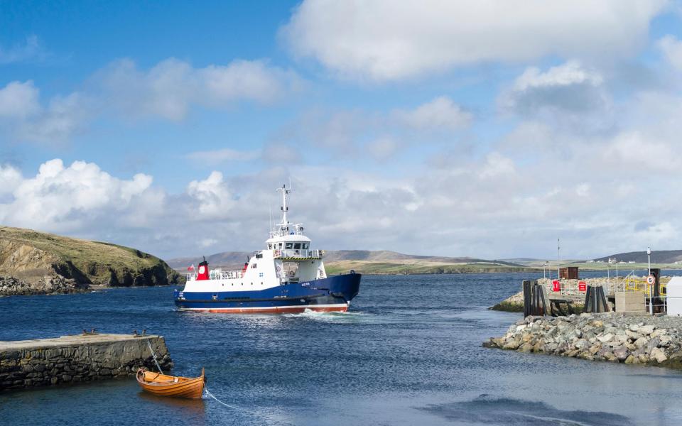 A ferry delivers passengers to Unst, the UK's northernmost inhabited island - ALAMY