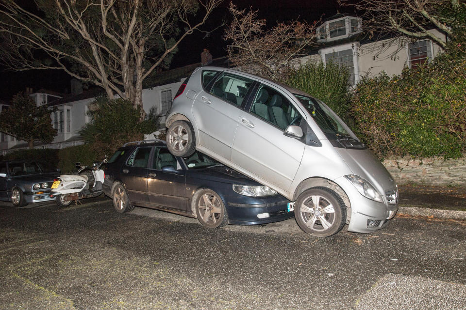 One car was parked on top of another (Picture: SWNS)