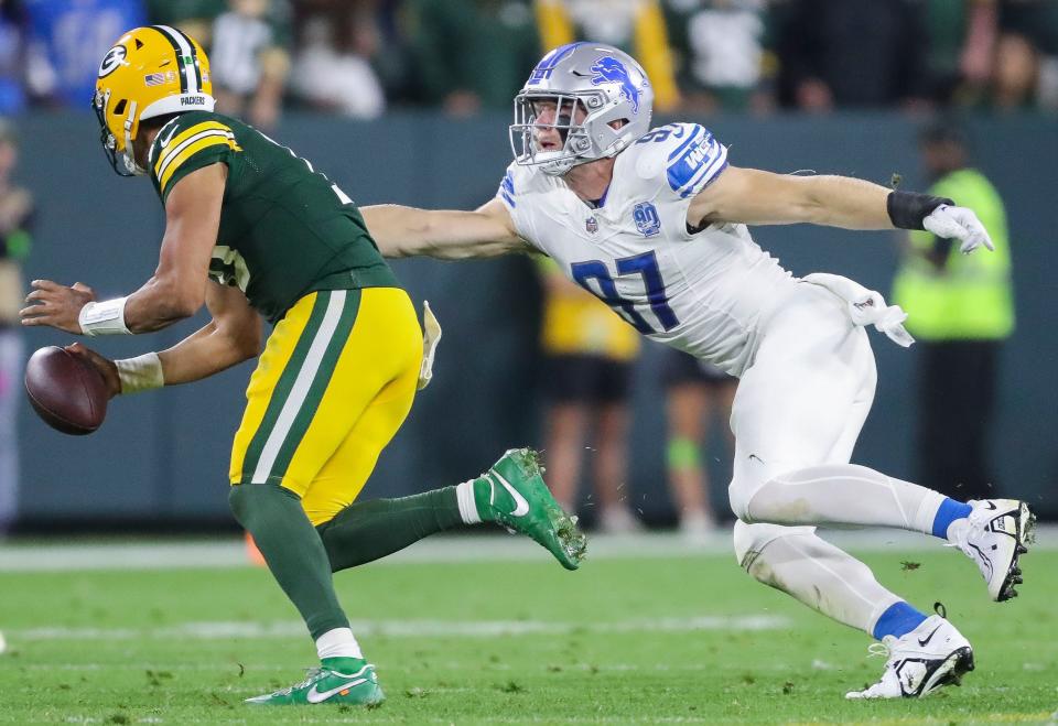 Detroit Lions defensive end <a class="link " href="https://sports.yahoo.com/nfl/players/33957" data-i13n="sec:content-canvas;subsec:anchor_text;elm:context_link" data-ylk="slk:Aidan Hutchinson;sec:content-canvas;subsec:anchor_text;elm:context_link;itc:0">Aidan Hutchinson</a> (97) chases down Green Bay Packers quarterback Jordan Love (10) for a sack during their football game on Thursday, September 28, 2023, at Lambeau Field in Green Bay, Wis. The Lions won the game, 34-20. Tork Mason/USA TODAY NETWORK-Wisconsin