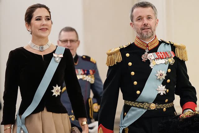<p>MADS CLAUS RASMUSSEN/Ritzau Scanpix/AFP via Getty </p> Crown Princess Mary and Crown Prince Frederik enter the New Year's reception at Christiansborg Palace on Jan. 4.