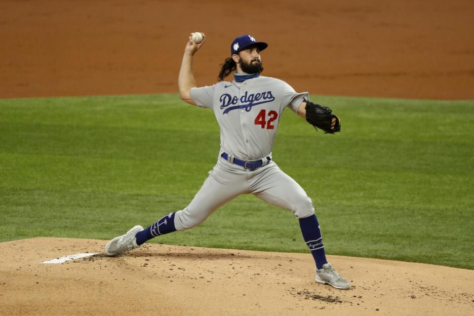 Dodgers starting pitcher Tony Gonsolin delivers during the first inning of Sunday's win over the Texas Rangers.