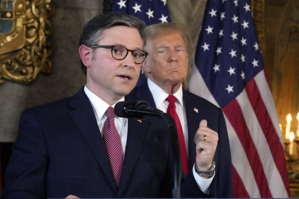 Speaker of the House Mike Johnson, R-La., speaks as Republican presidential candidate former President Donald Trump listens during a news conference, Friday, April 12, 2024, at Mar-a-Lago in Palm Beach, Fla. (AP Photo/Wilfredo Lee)