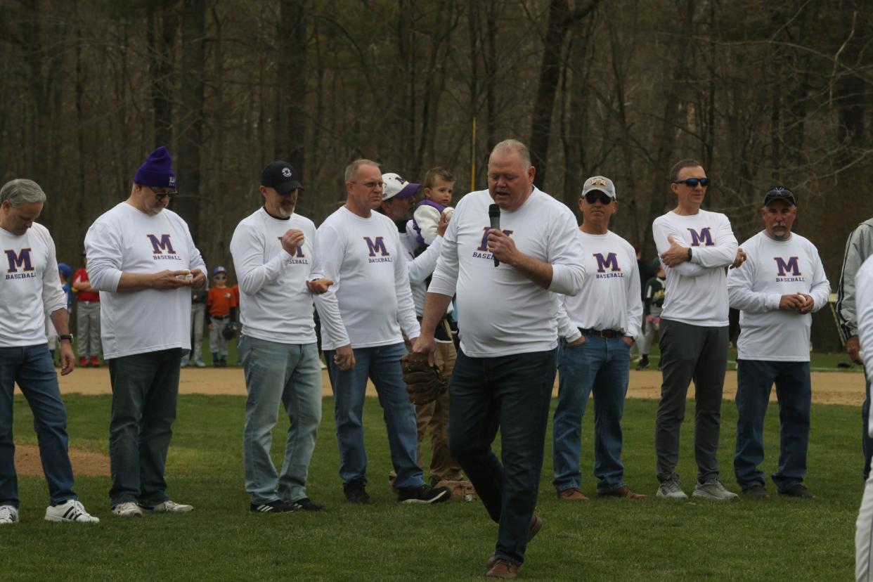 Rheinhold Holton, member of Marshwood's 1984 state championship baseball team, speaking to the crowd on Saturday prior to the Hawks game against Noble at Marshwood High School.