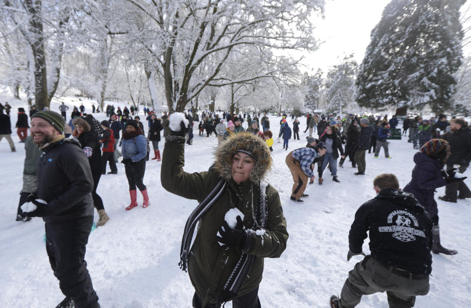 Several hundred people take part in a public snowball fight, Saturday, Feb. 9, 2019, at Wright Park in Tacoma, Wash. Word of the friendly battle spread on social media Friday night and Saturday, as a winter storm that blanketed Washington state with snow moved south into Oregon and meteorologists warned that yet more winter weather was on the way. (AP Photo/Ted S. Warren)