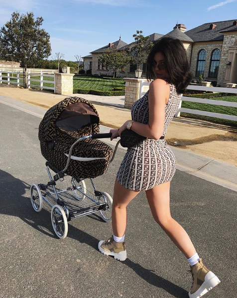 The new mum dotes on her baby, taking her for walks and cooing over her in the new video. Source: Instagram/KylieJenner