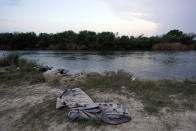 A deflated raft sits along the U.S.-Mexico border Tuesday, May 11, 2021, in Roma, Texas. The U.S. government continues to report large numbers of migrants crossing the U.S.-Mexico border with an increase in adult crossers. But families and unaccompanied children are still arriving in dramatic numbers despite the weather changing in the Rio Grande Valley registering hotter days and nights. (AP Photo/Gregory Bull)