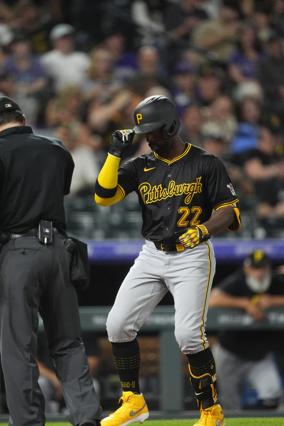 Pittsburgh Pirates' Andrew McCutchen steps on home plate after hitting a solo home run off Colorado Rockies relief pitcher Geoff Hartlieb during the seventh inning of a baseball game Saturday, June 15, 2024, in Denver. (AP Photo/David Zalubowski)