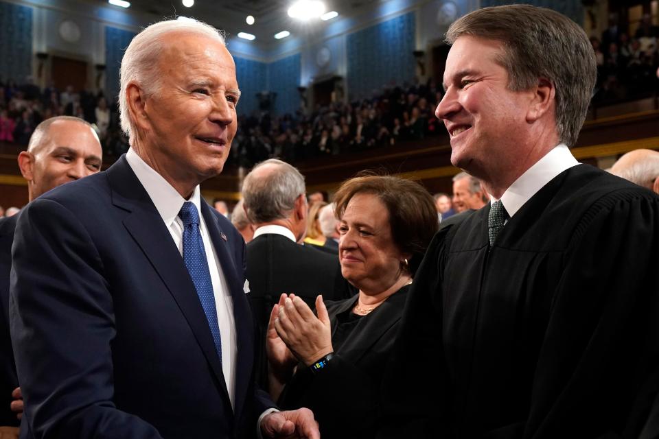 President Joe Biden greets Supreme Court Justice Brett Kavanaugh as he arrives to deliver the State of the Union address to a joint session of Congress at the Capitol, Tuesday, March 1, 2023, in Washington.