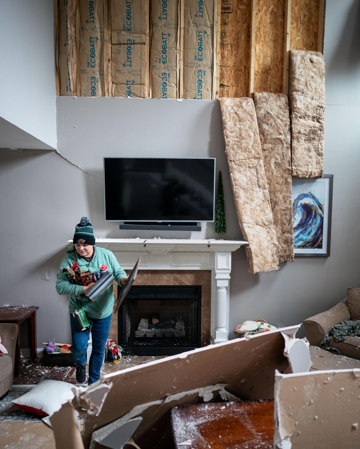 Shiann Arnold packs up Christmas decorations inside of her damaged home in Clarksville, Tenn., Sunday, Dec. 10, 2023. Tornadoes struck Middle Tennessee on Saturday, killing at least six people and leaving more than 160,000 Middle Tennessee residents without power.