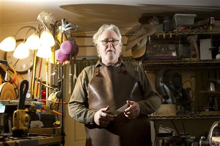 Michael Holmes, who lives on a fixed income and crafts knifes as a hobby, stands in his workshop in Fort Bragg, California February 25, 2014. As drought conditions continue throughout Northern California, Holmes and fellow Mendocino County residents have watched their water supply dwindle. REUTERS/Noah Berger