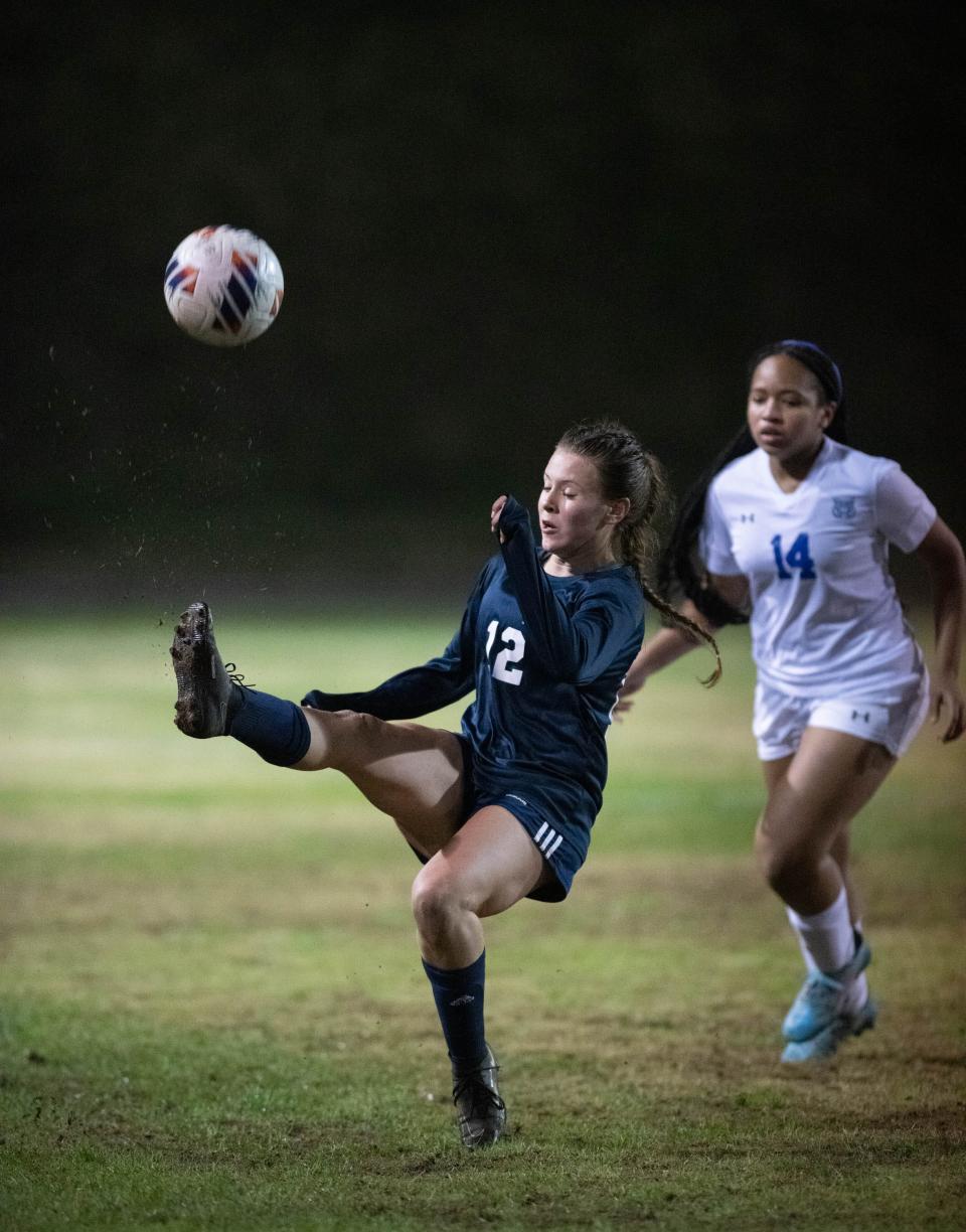 Jillian Thompson (12) passes the ball during the Booker T. Washington vs Escambia girls soccer game at Escambia High School in Pensacola on Friday, Jan. 6, 2023.