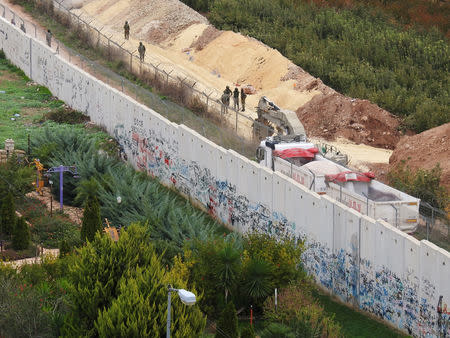 Israeli soldiers patrol the border near the village of Kfar Kila, Lebanon December 4, 2018. REUTERS/ Karamallah Daher