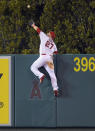 FILE - In this Sept. 26, 2015, file photo, Los Angeles Angels' Mike Trout makes a catch at the wall on a ball hit by Seattle Mariners' Jesus Montero during the fourth inning of a baseball game in Anaheim, Calif. A person familiar with the negotiations tells The Associated Press Tuesday, March 19, 2019, that Trout and the Angels are close to finalizing a record $432 million, 12-year contract that would shatter the record for the largest deal in North American sports history. (AP Photo/Mark J. Terrill, File)