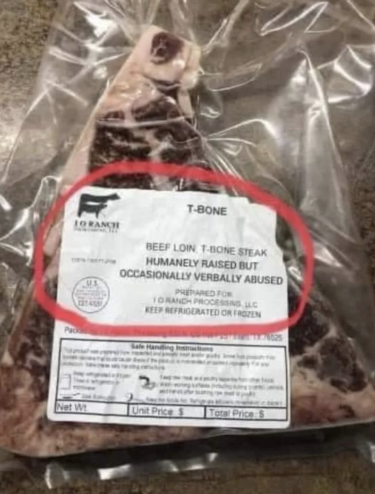 Packaged T-bone steak with a label jokingly stating "humanely raised but occasionally verbally abused."