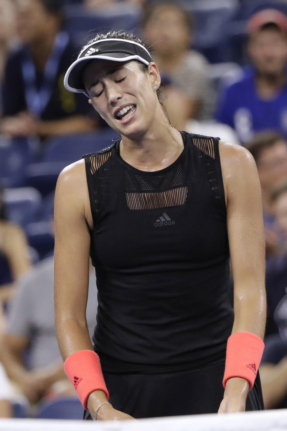 Garbine Muguruza, of Spain, reacts after losing a point to Karolina Muchova, of the Czech Republic, during the second round of the U.S. Open tennis tournament early Thursday, Aug. 30, 2018, in New York. (AP Photo/Jason DeCrow)