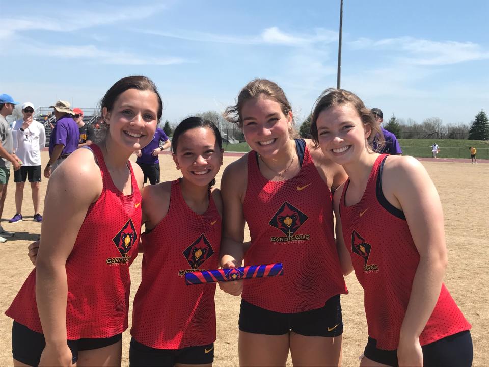 Members of the Seton girls track team pose after their performance April 23, 2022, at the Guerin Catholic Invite.
