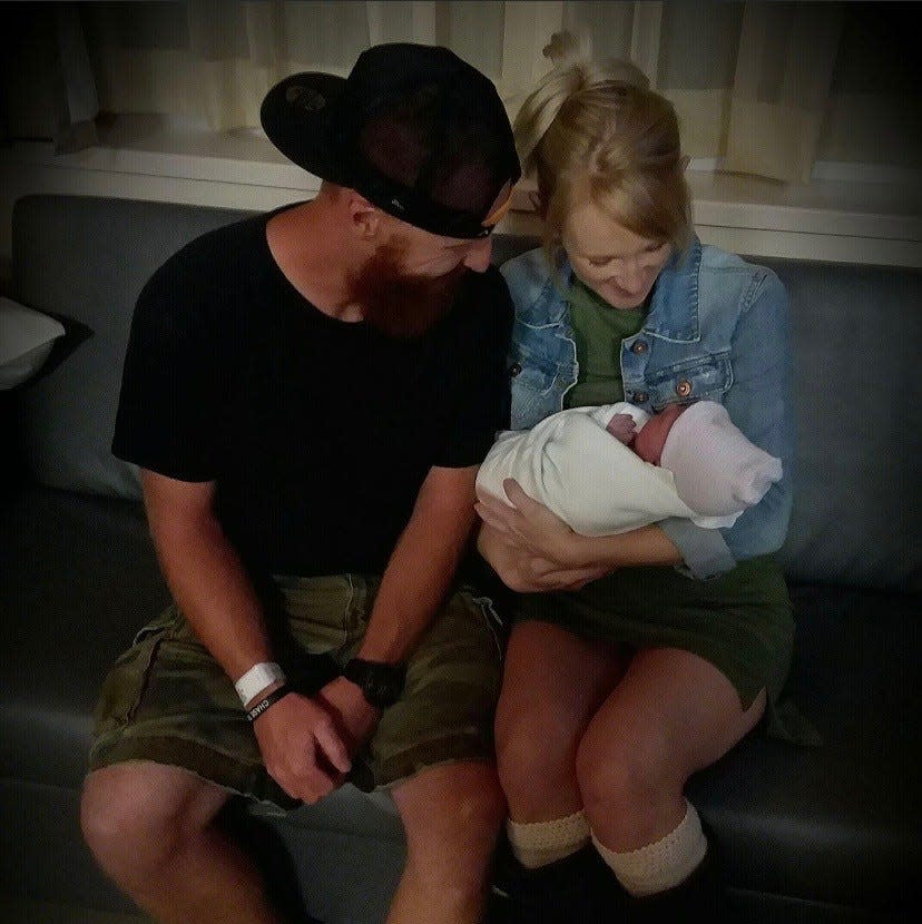 Jordan Calhoun and his sister, Whitney Calhoun, spend a moment with his newborn child in this undated family photograph. Whitney Calhoun, 33, of Gastonia, died Wednesday, Aug. 17, 2022, four days after being struck by a suspected impaired driver.