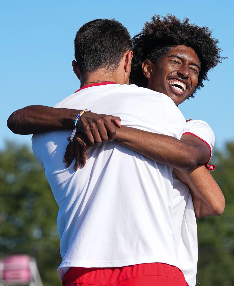 North Central Maurquis Willingham hugs Alex Antonopoulos  Saturday, Oct. 15, 2022, at Carmel High School in Carmel. North Central won the state championship title. 