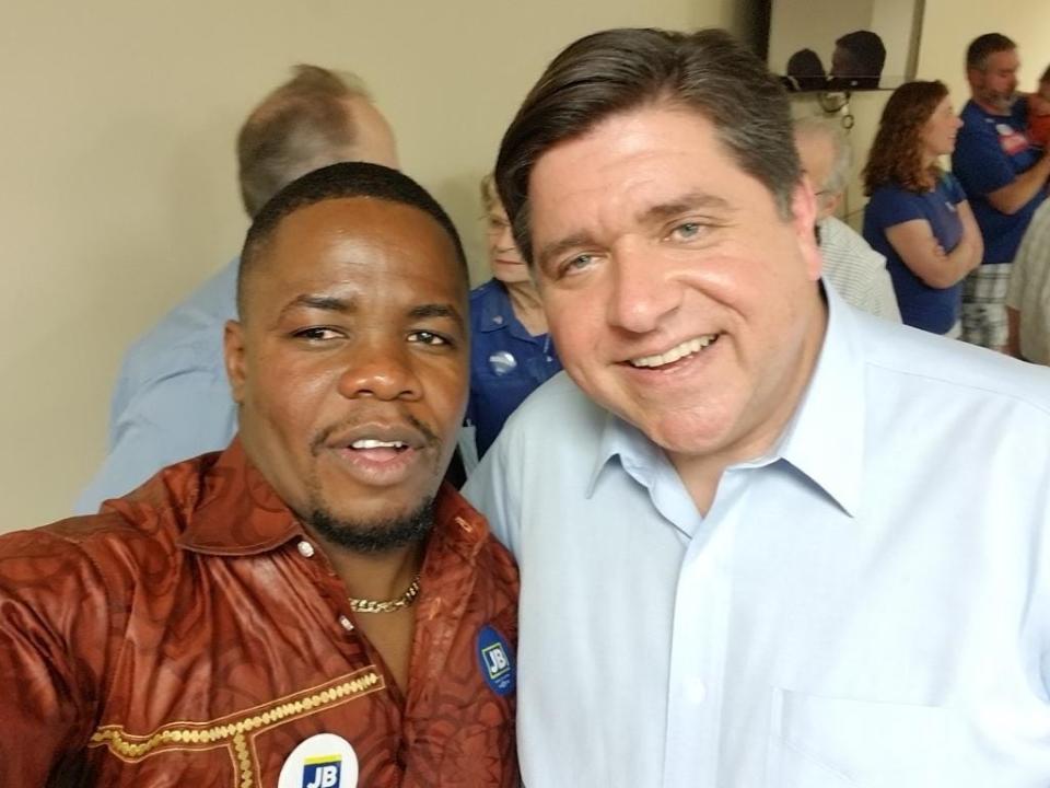 Simplice Kuelo, president of Local 431 of the United Food and Commercial Workers, with Illinois Gov. J.B. Pritzker. Dues from a plant in Illinois, a closed-shop state where all workers represented by a union must pay the weekly fees, make 4,200-member Local 431 the best-financed of the Iowa-based UFCW locals.