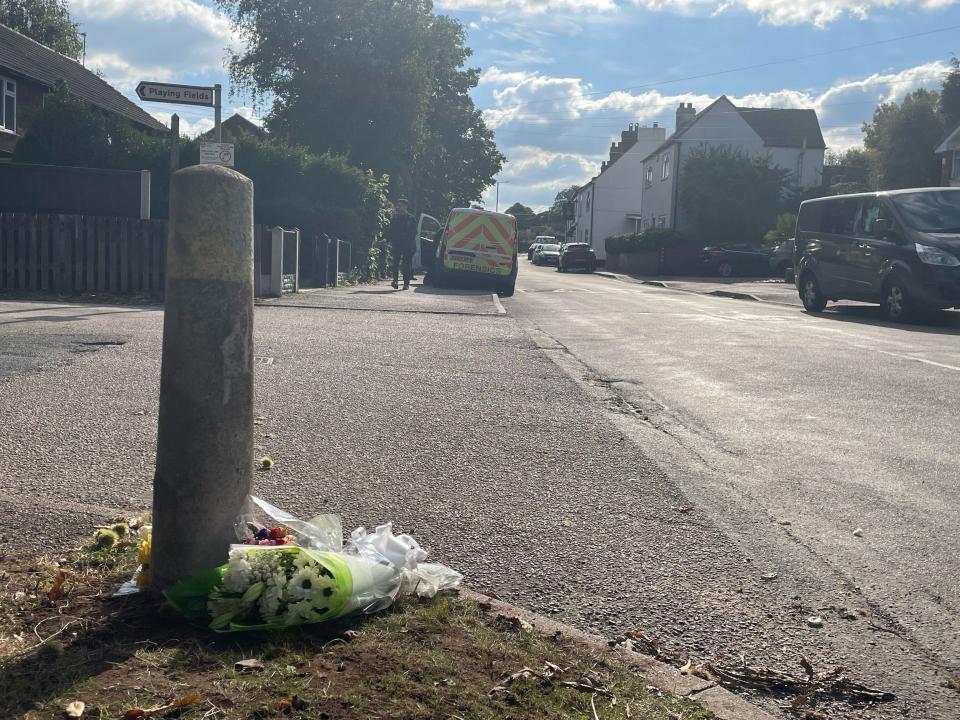 Floral tributes outside a property in Main Street, Stonnall, Staffordshire, after a man died after being bitten by two dogs. A 30-year-old man from the Lichfield area has been arrested on suspicion of having dogs dangerously out of control, police said.