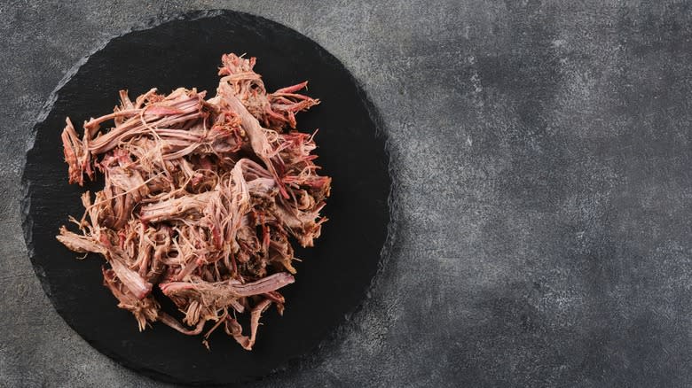 Pulled pork on dark plate