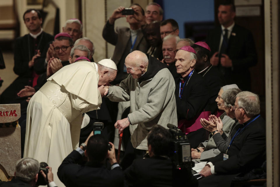 Pope Francis greets father Jean-Pierre Schumacher, a French monk who survived the Tibhirine killing, when seven Trappist monks and 12 other Catholics were kidnapped from the monastery of Tibhirine, south of Algiers in 1996 and killed, in the Rabat Cathedral, Morocco, Sunday, March 31, 2019. Pope Francis is in Morocco for a two-day trip aimed at highlighting the North African nation's Christian-Muslim ties, while also showing solidarity with migrants at Europe's door and tending to a tiny Catholic flock. (AP Photo/Mosa'ab Elshamy)