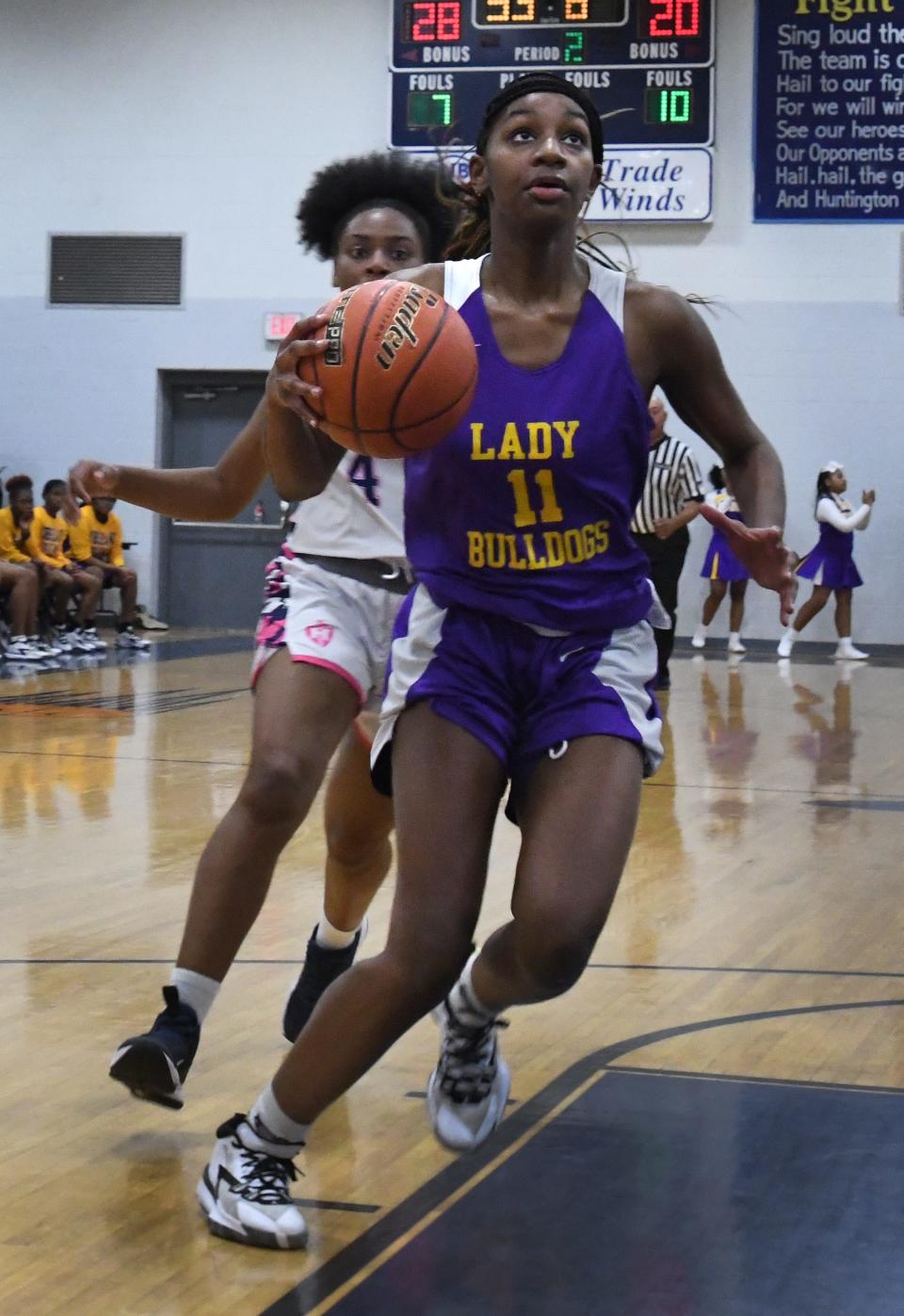 Gibsland-Coleman's Samora Sampson drives to the net against Huntington.