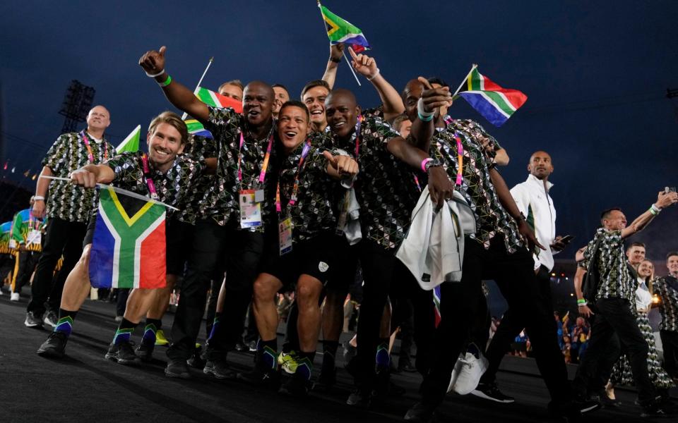 The athletes of South Africa enter the stadium during the Commonwealth Games opening ceremony at the Alexander stadium - AP