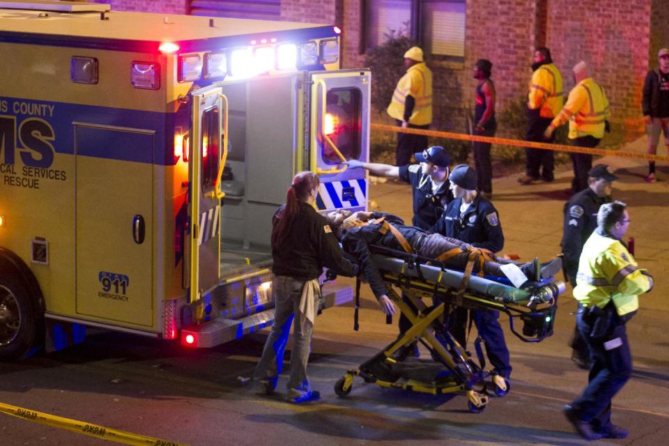 A man is transported to an ambulance after being struck by a vehicle on Red River Street in downtown Austin, Texas, during SXSW on Wednesday March 12, 2014. Police say two people were confirmed dead at the scene after a car drove through temporary barricades set up for the South By Southwest festival and struck a crowd of pedestrians. (AP Photo/Austin American-Statesman, Jay Janner)