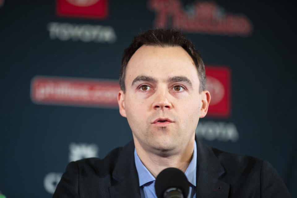 FILE - In this Dec. 16, 2019, file photo, Philadelphia Phillies general manager Matt Klentak speaks at an introductory news conference for new Phillies baseball players Zack Wheeler and Didi Gregorius in Philadelphia. Klentak has stepped down as general manager of the Phillies after a third straight September collapse left the team out of the postseason for the ninth consecutive season. (AP Photo/Matt Rourke, File)