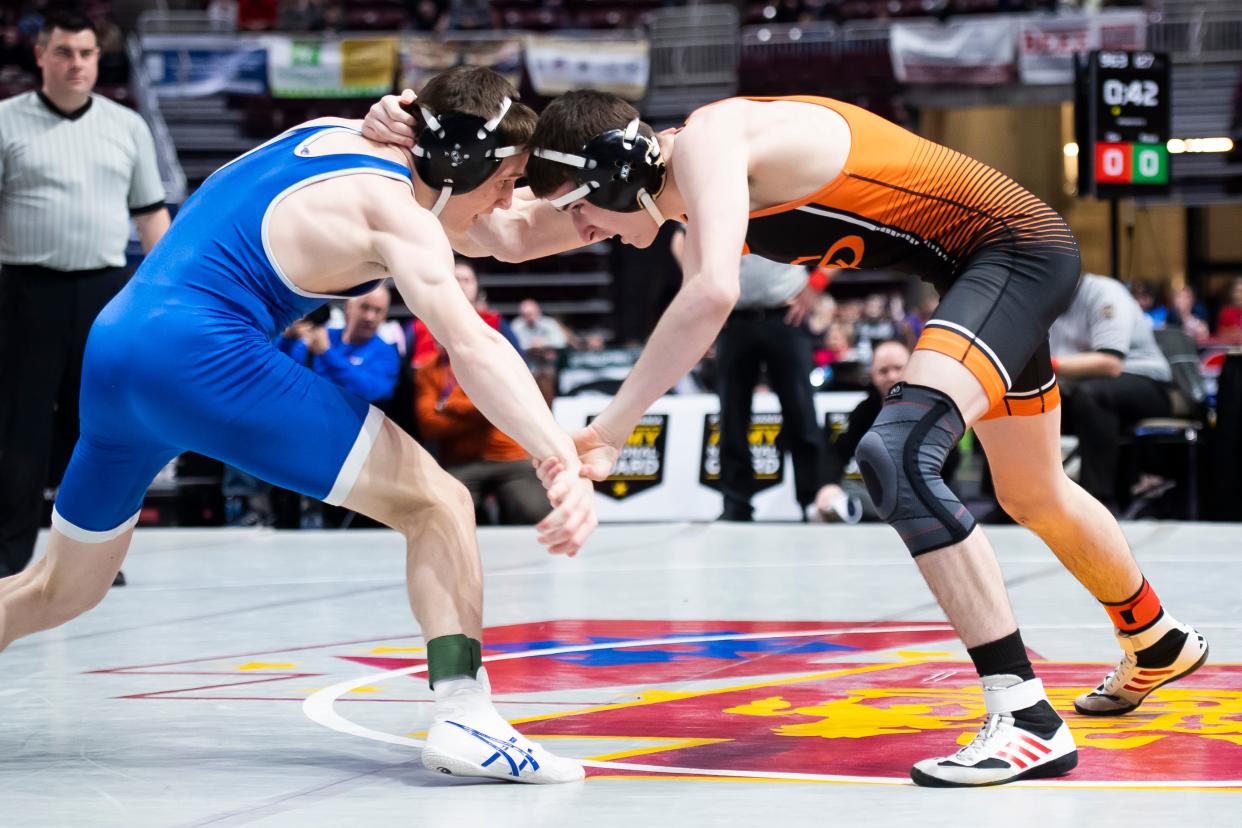 Cathedral Prep's Keegan Oler (right) wrestles Lower Dauphin's Cael Rossi in a 127-pound first round bout at the PIAA Class 3A Wrestling Championships at the Giant Center on March 7, 2024, in Hershey. Rossi won by decision, 7-3.