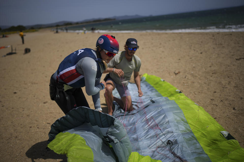 FILE - U.S. Olympic sailing team member Daniela Moroz prepares for a kiteboarding session in Hyeres, southern France, Monday, April 29, 2024. Fans looking for something different at the Olympics might want to check out kitesurfing. (AP Photo/Daniel Cole, File)