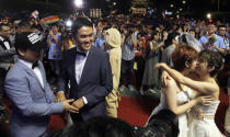 Taiwanese same-sex couples kiss at their wedding party in Taipei, Taiwan, Saturday, May 25, 2019. Taiwan became the first place in Asia to allow same-sex marriage last week. Hundreds of same-sex couples in Taiwan rushed to get married Friday, the first day a landmark decision that legalized same-sex marriage took effect. (AP Photo/Chiang Ying-ying)