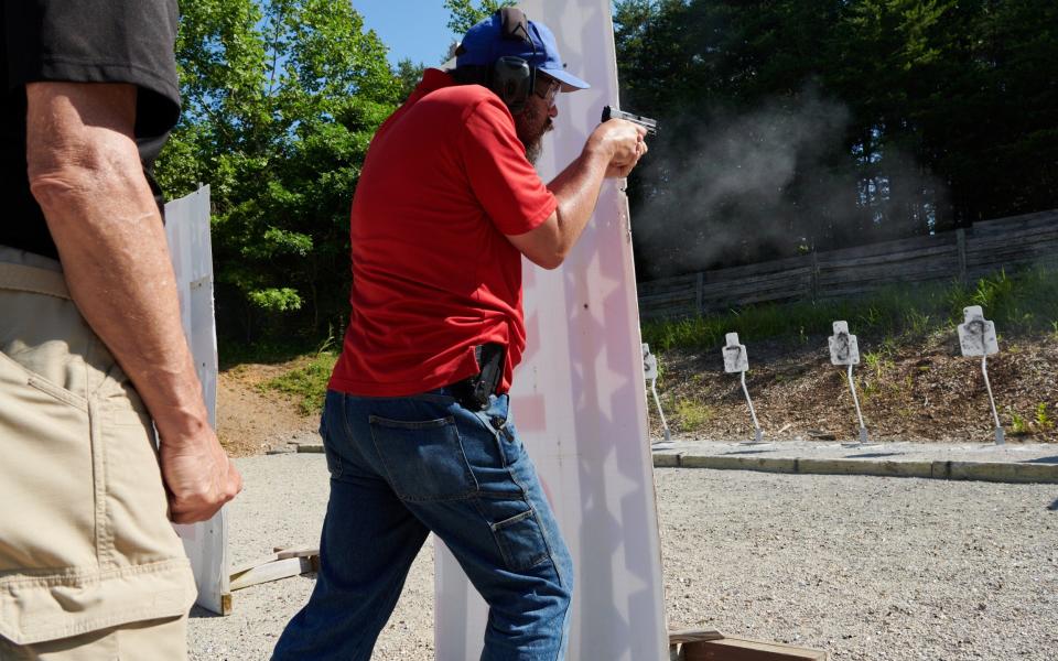 A FASTER 2 course participant practices dropping in from behind cover at the Tactical Defense Institute firing range in West Union, Ohio. - Stephen Takacs for The Telegraph