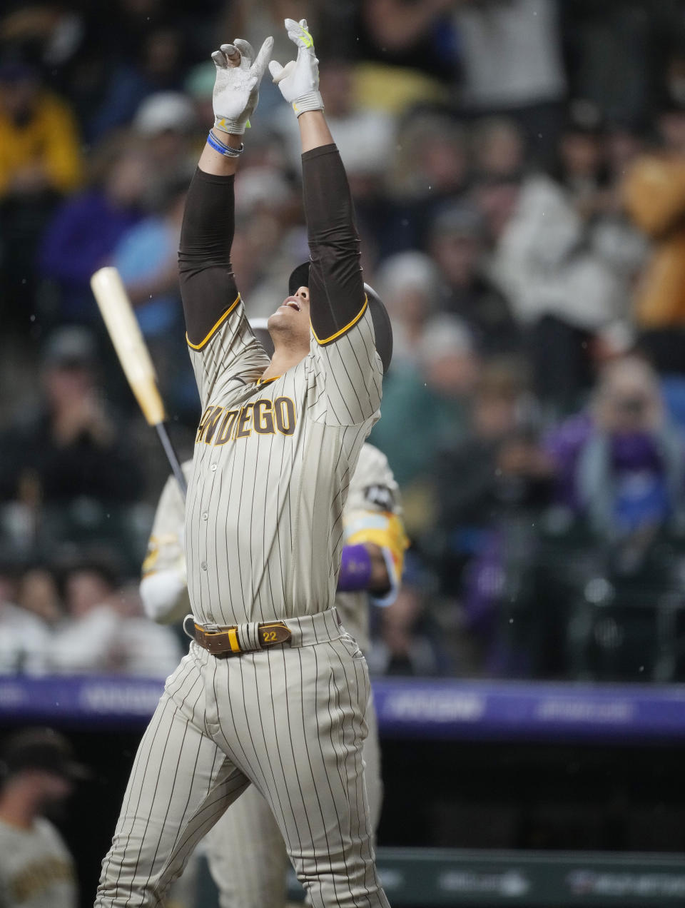 San Diego Padres' Juan Soto gestures as he crosses home plate after hitting a solo home run against Colorado Rockies relief pitcher Tyler Kinley in the eighth inning of a baseball game Tuesday, Aug. 1, 2023, in Denver. (AP Photo/David Zalubowski)