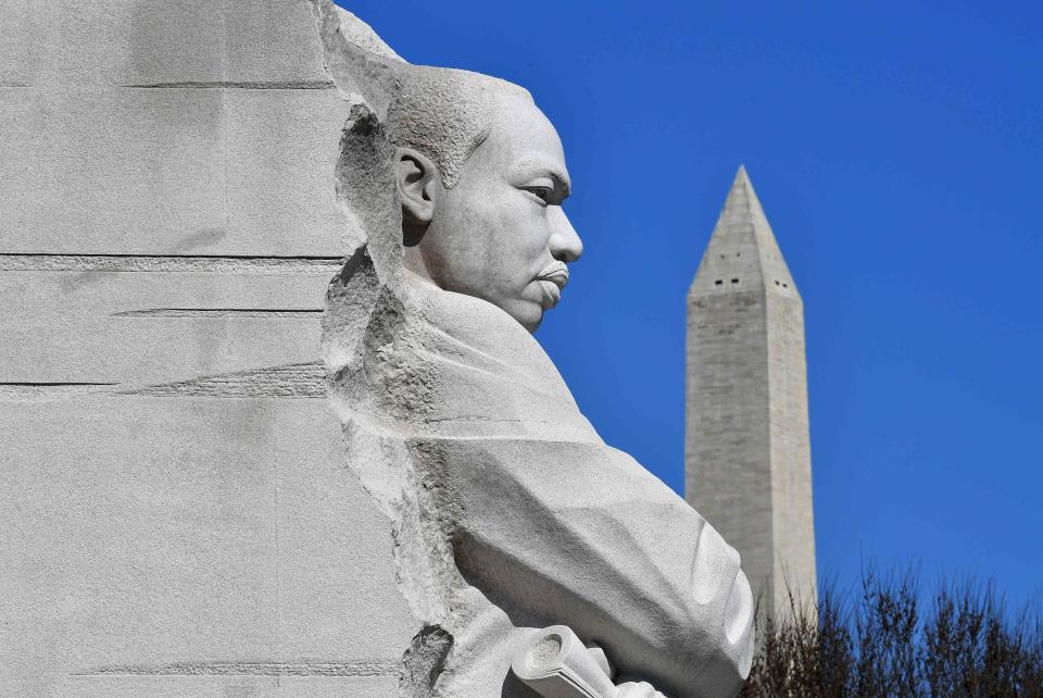 The Washington Memorial is seen behind the "Stone of Hope" statue at the Martin Luther King Jr. Memorial in Washington, D.C. on March 19, 2019.