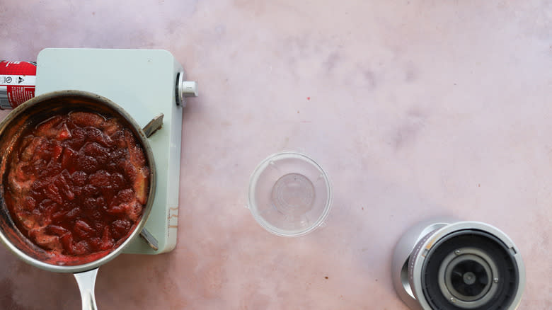 Blender bowl with strawberry sauce