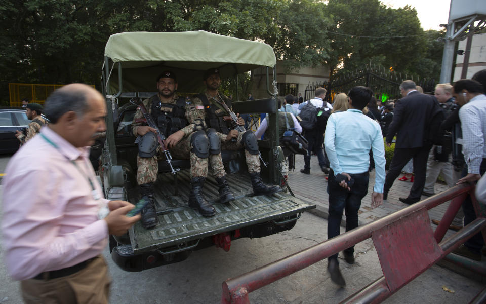 Pakistani soldiers are on alert ahead of the arrival of Britain's Prince William and his wife Kate for a reception in Islamabad, Pakistan, Tuesday, Oct. 15, 2019. The Royal couple kicked off a five-day tour of Pakistan on Tuesday amid much fanfare and tight security. (AP Photo/B.K. Bangash)