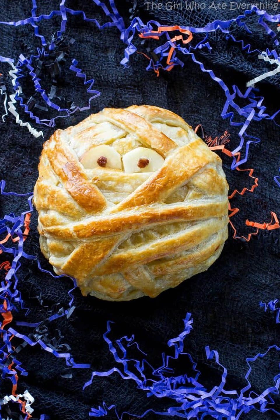 <p>This spooky pastry face is packed with Brie cheese, brown sugar, and cinnamon pecans for a delicious <a rel="nofollow noopener" href="https://www.womansday.com/food-recipes/g2574/easy-halloween-appetizers/" target="_blank" data-ylk="slk:Halloween appetizer;elm:context_link;itc:0;sec:content-canvas" class="link ">Halloween appetizer</a>. </p><p><strong>Get the recipe at <a rel="nofollow noopener" href="http://www.the-girl-who-ate-everything.com/2016/10/mummy-brie.html" target="_blank" data-ylk="slk:The Girl Who Ate Everything;elm:context_link;itc:0;sec:content-canvas" class="link ">The Girl Who Ate Everything</a>. </strong></p>