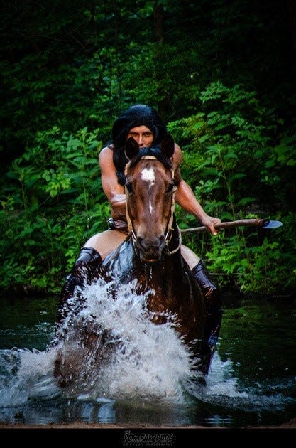 Blue Jacket, portrayed by Colin Swackhammer, takes his horse across the Ohio River.