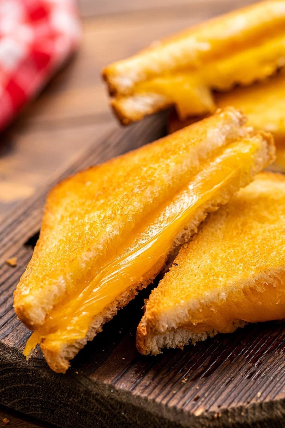 Air fryer grilled cheese sandwich sliced in half.