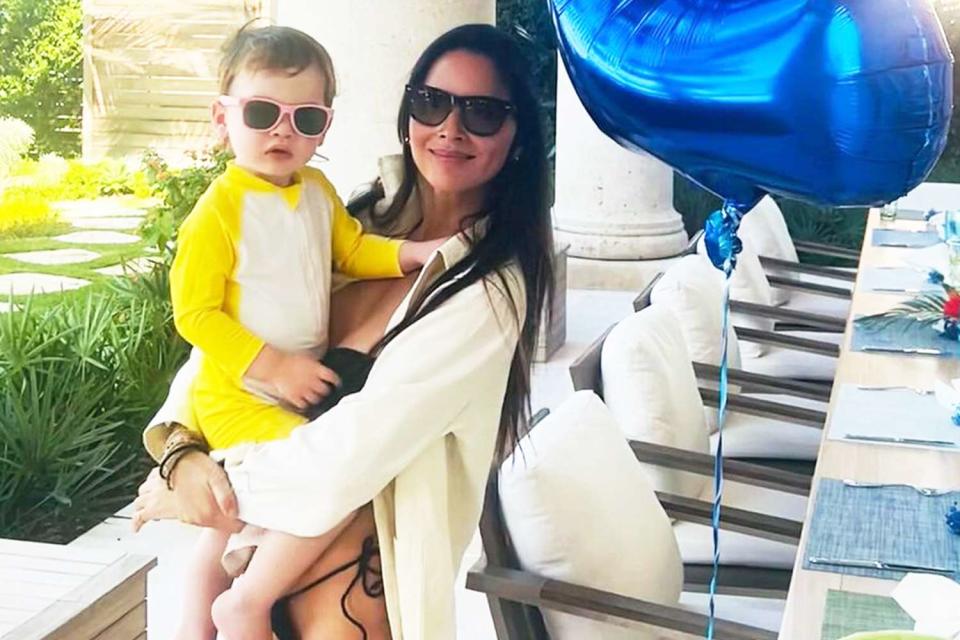 <p>Olivia Munn/Instagram</p> Olivia Munn posing with son Malcolm on his second birthday. 