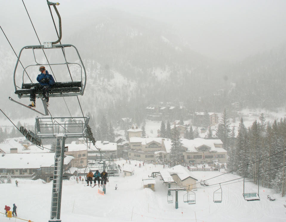 FILE - In this Feb. 21, 2008, file photo, skiers ride up Al's Run lift at the Taos Ski Valley, in Taos County, N.M. Some resorts are closing enclosed gondolas or aerial trams while others are encouraging skiers to ride lifts with only people they know as they adhere to social distancing guidelines. Nearly every resort is promising extra cleanings of public spaces, more hand sanitizer stations and vowing to follow guidelines from the Centers for Diesel Control and Prevention. Taos Ski Valley, has decided to close for the season early on March 22, 2020. (AP Photo/Albuquerque Journal, File)