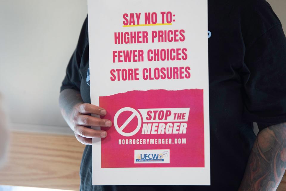 A United Food and Commercial Workers International Union (UFCW) member holds a sign against the Kroger-Albertons merger during a townhall at the Joseph H. Edwards Active Adult Center in Pueblo on Thursday, June 29, 2023.