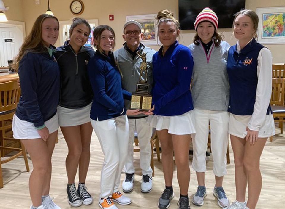 Lemon Bay High Team Champions, from left, Haley Hall, Izzy Ragazzone, Madison Hanson, Coach Darrell Roach, Sophia Stiwich, Rachel Gillis, Alaina Maday.