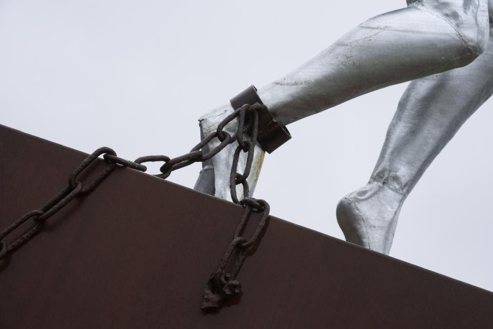 Clave, Monument for Slavery, by Alex da Silva, is seen in Rotterdam, Netherlands, Monday, Dec. 19, 2022. The Dutch government is expected to issue a long-awaited formal apology for its role in the slave trade, with a speech by Dutch Prime Minister Mark Rutte, and ceremonies in the former colonies. (AP Photo/Peter Dejong)