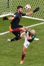 <p>Mexico’s forward Javier Hernandez (R) vies for the ball with Brazil’s goalkeeper Alisson during the Russia 2018 World Cup round of 16 football match between Brazil and Mexico at the Samara Arena in Samara on July 2, 2018. (Photo by SAEED KHAN / AFP) </p>