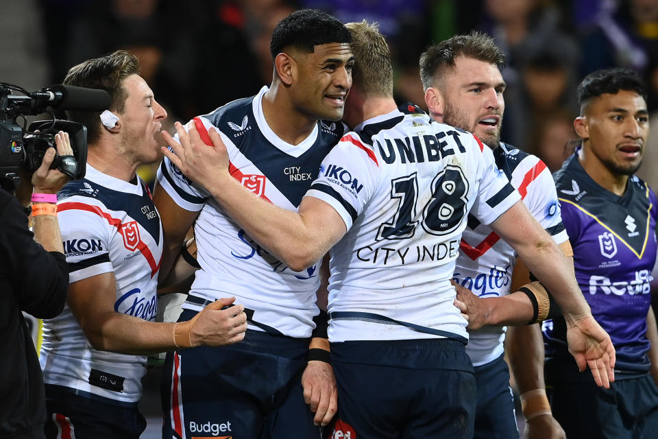 Daniel Tupou, pictured here after scoring for the Roosters against the Storm.