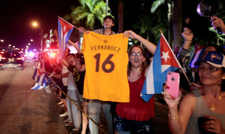 People celebrate after the announcement of the death of Cuban revolutionary leader Fidel Castro, in the Little Havana district of Miami, Florida, U.S. November 26, 2016. REUTERS/Javier Galeano