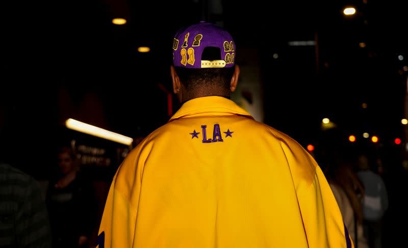 Mourners gather in Microsoft Square near the Staples Center to pay respects to Kobe Bryant after a helicopter crash killed the retired basketball star, in Los Angeles